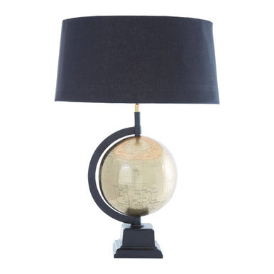 Antique brass globe lamp in a study setting