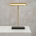 Brass desk lamp with a black marble base
