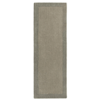Taupe bordered wool rug in a room