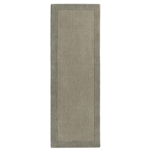 Taupe bordered wool rug in a room