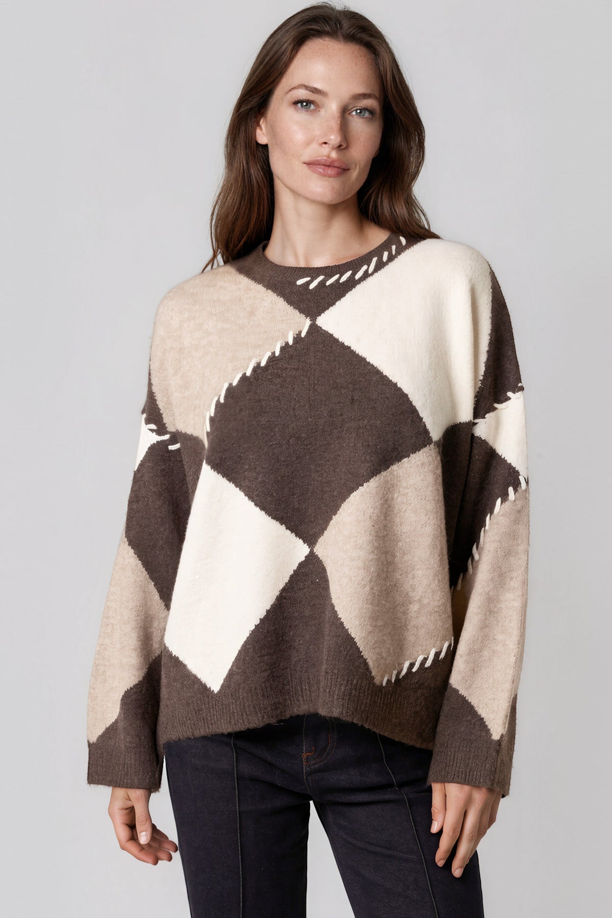 Brown argyle wool-blend jumper, worn