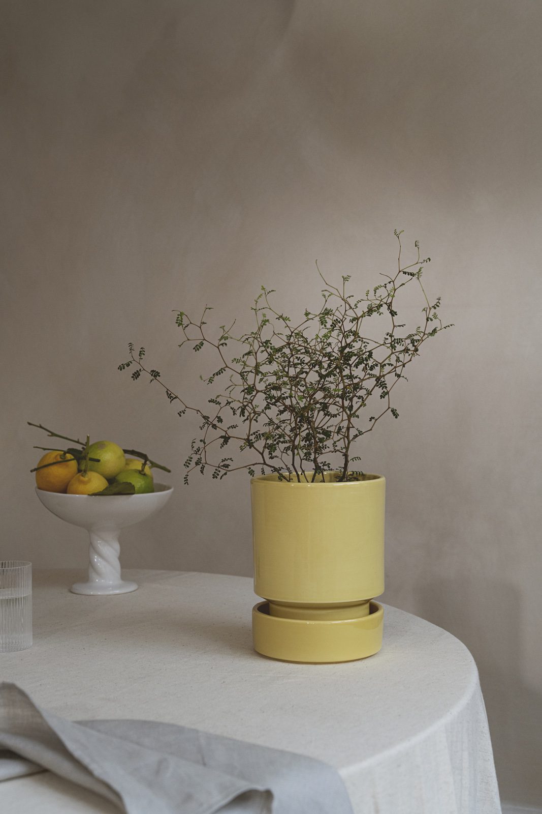 Raw terracotta plant pot with a simple stackable shape