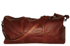 Large leather duffel bag with leather handles and shoulder strap